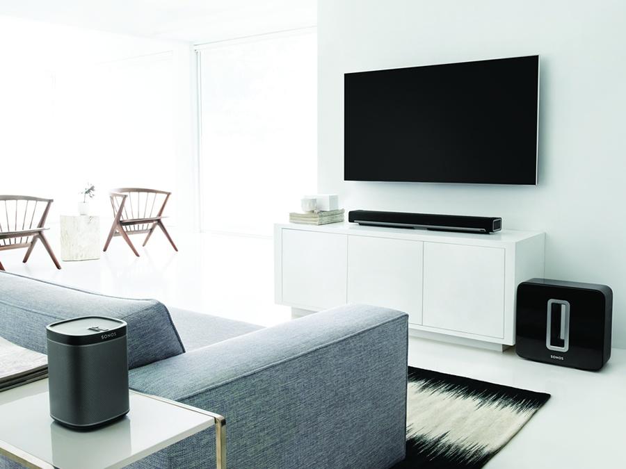 A header image from a retrofit gallery showcasing a stylish living room interior with updated modern furnishings, abundant natural light, and contemporary décor.