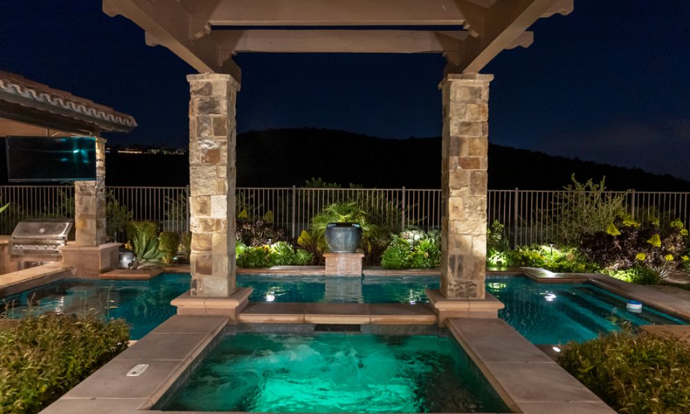 A beautiful outdoor area with a swimming pool and entertainment.