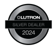 Circular silver badge with the Lutron logo and the text “Silver Dealer 2024” on a black background.