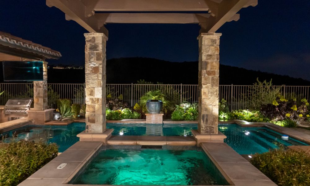 A beautiful outdoor area with a swimming pool and entertainment.