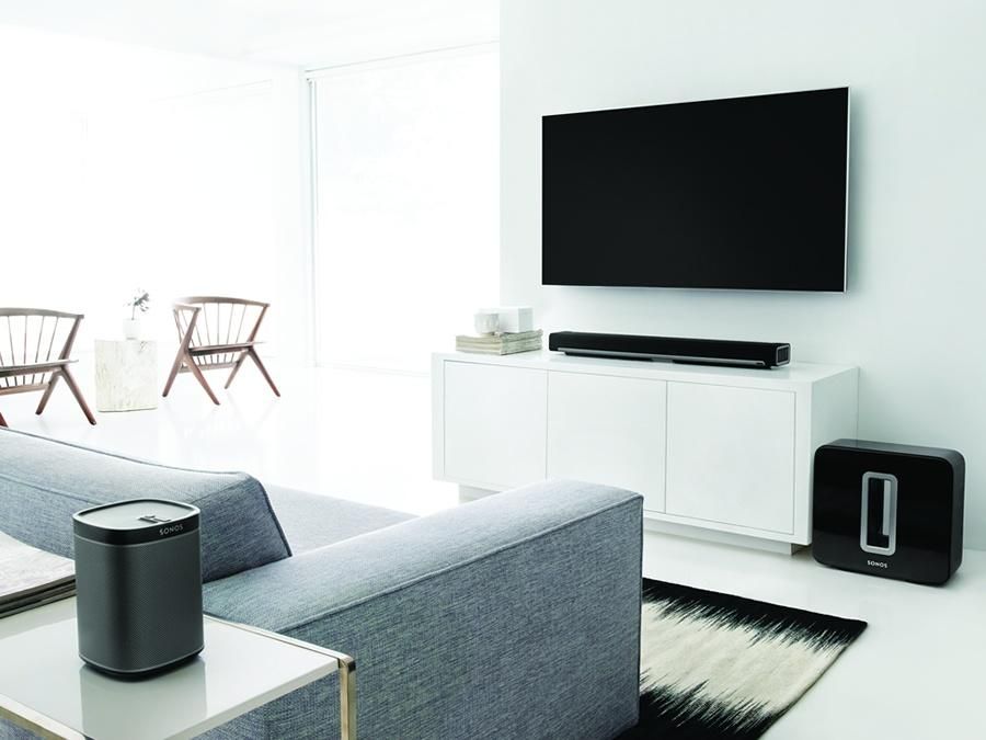 A header image from a retrofit gallery showcasing a stylish living room interior with updated modern furnishings, abundant natural light, and contemporary décor.